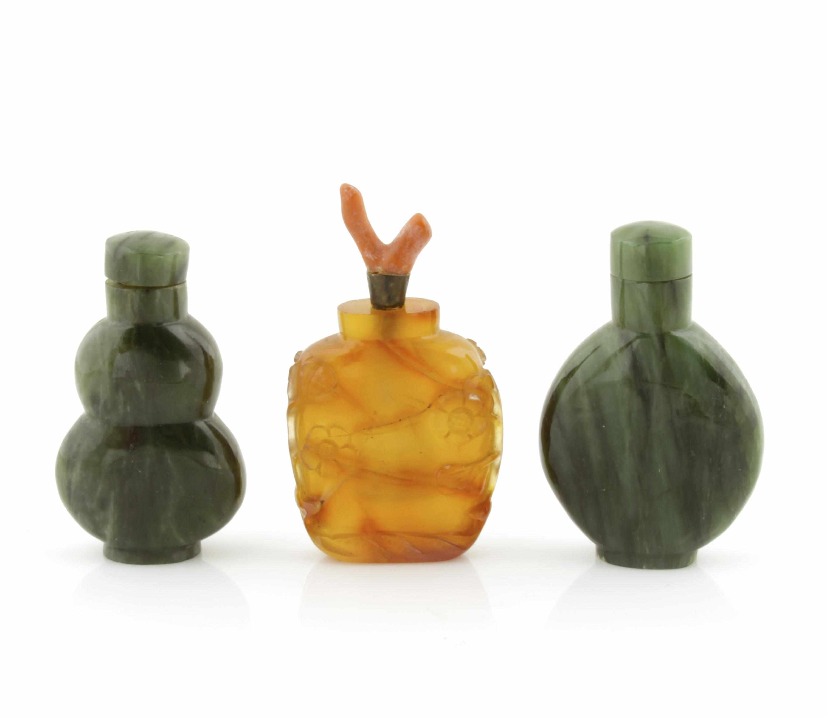 Appraisal: Carnelian Snuff Bottle and Two Nephrite Snuff Bottles The carnelian