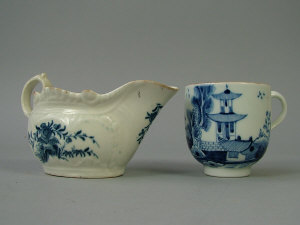 Appraisal: A Worcester blue and white sauceboat the rococo moulded body