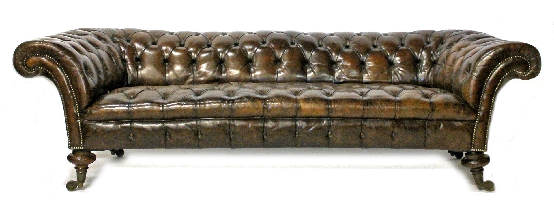 Appraisal: A th century low back brown leather button upholstered Chesterfield