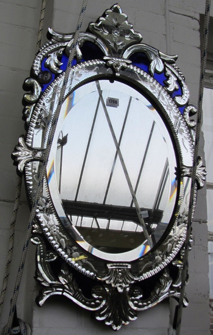 Appraisal: A Victorian cut and etched glass oval wall mirror with