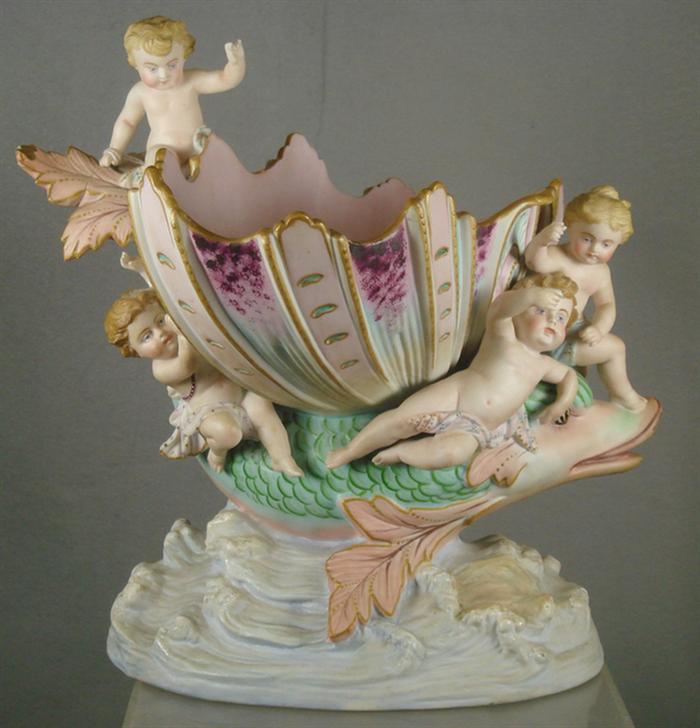 Appraisal: Bisque compote depicting shell supported by fish and cherubs indistinctly