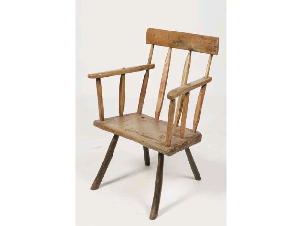 Appraisal: AN IRISH HEDGE CHAIR with a broad top rail on