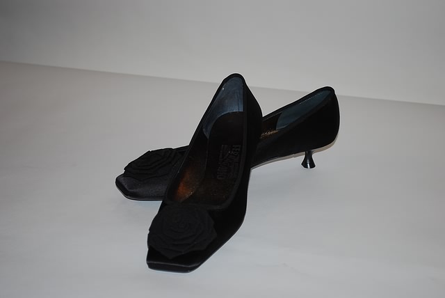 Appraisal: Salvatore Ferragamo black pumps with tassels Size B Price Original