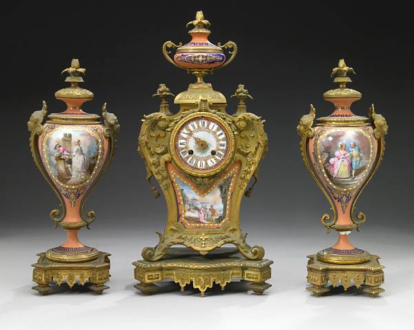 Appraisal: A French gilt bronze and porcelain clock garniture late th