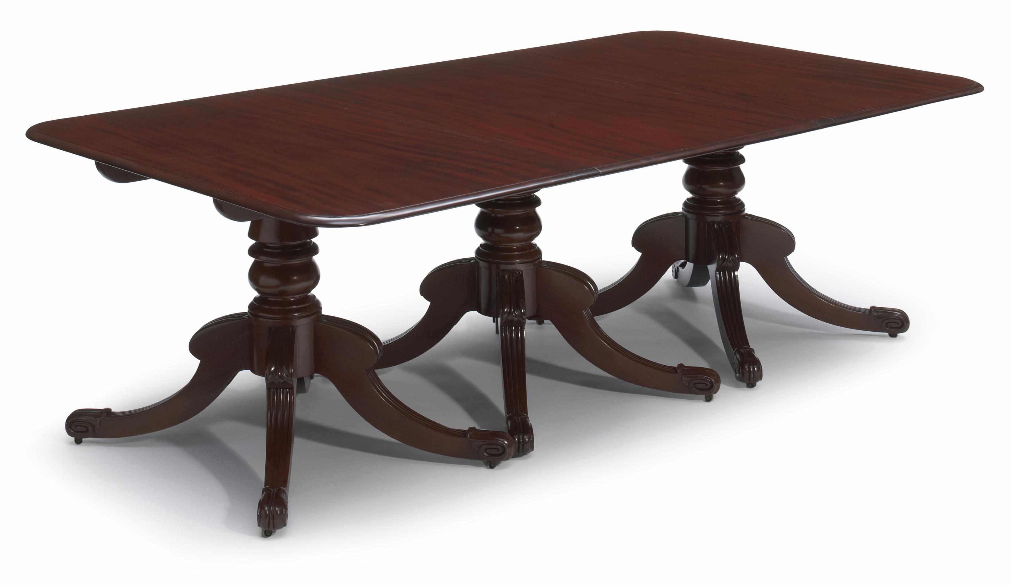 Appraisal: A Regency style mahogany triple pedestal dining table Includes two