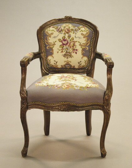 Appraisal: Louis XVI-Style Walnut-Stained Armchair the molded top rail centered by