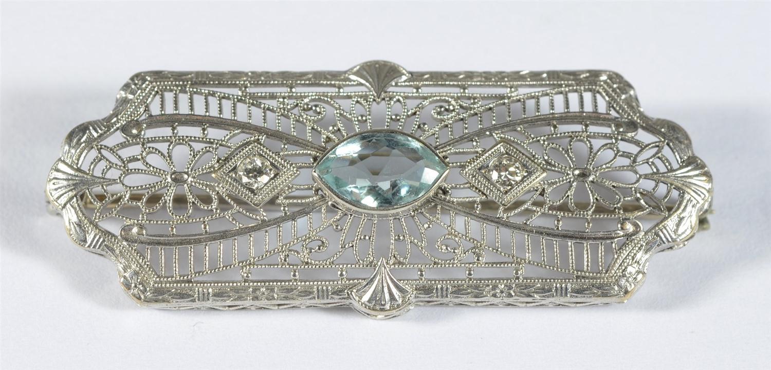 Appraisal: Unmarked K WG filigree broach small diamonds pale green stone