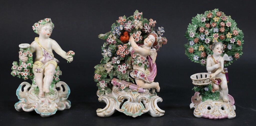 Appraisal: Chelsea or Derby style porcelain Cupid cherub figures with bocage