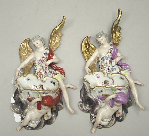 Appraisal: Two German porcelain figural wall pockets late th early th