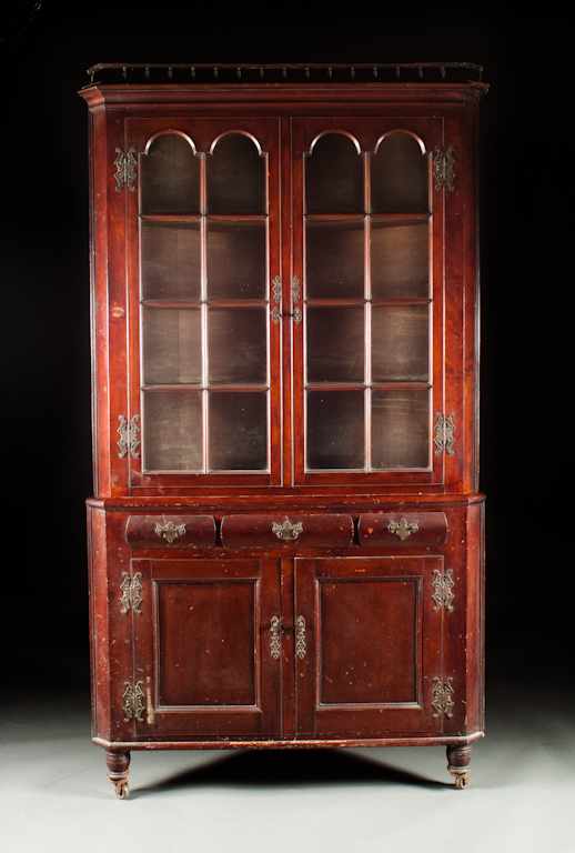 Appraisal: Centennial Chippendale style carved cherrywood glazed panel corner cupboard circa