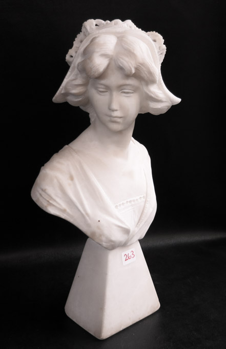 Appraisal: CARVED ITALIAN MARBLE BUST of a beautiful young woman wearing