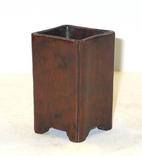 Appraisal: A walnut wood brushpot Of trapezoidal section with slighlty concave