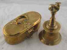 Appraisal: A heavy brass bell with sacred bull capital and an