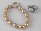 Appraisal: A mixed lot comprising an imitation pearl bracelet by Thomas