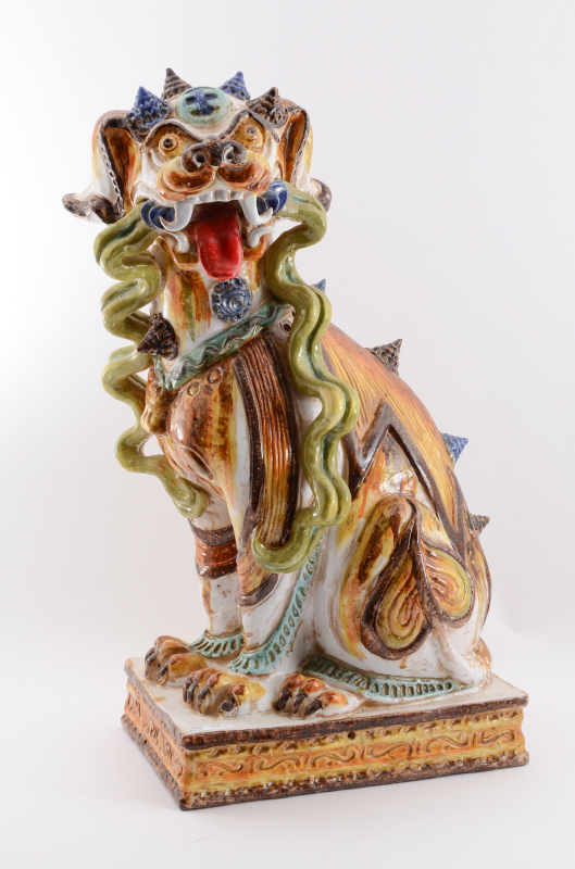 Appraisal: CHINESE POLYCHROME EARTHENWARE PALACE DOG Ceramic figural palace guard dog