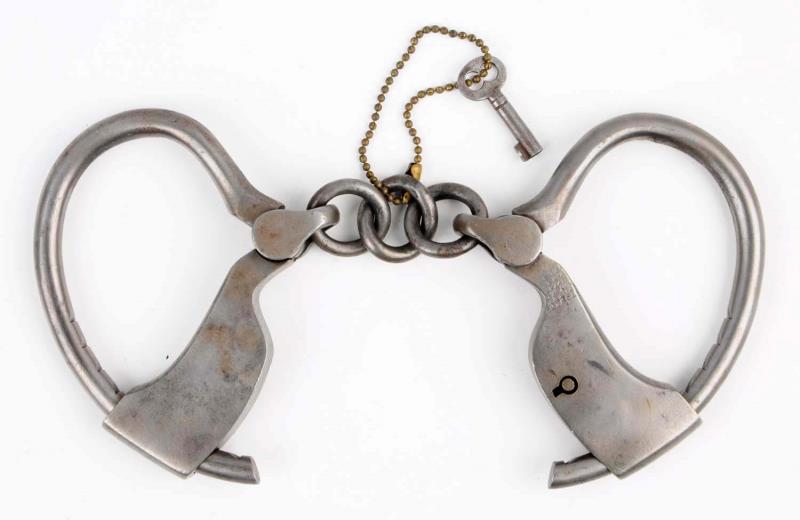 Appraisal: Tower Patent Shop Handcuffs Includes key Spring is missing on