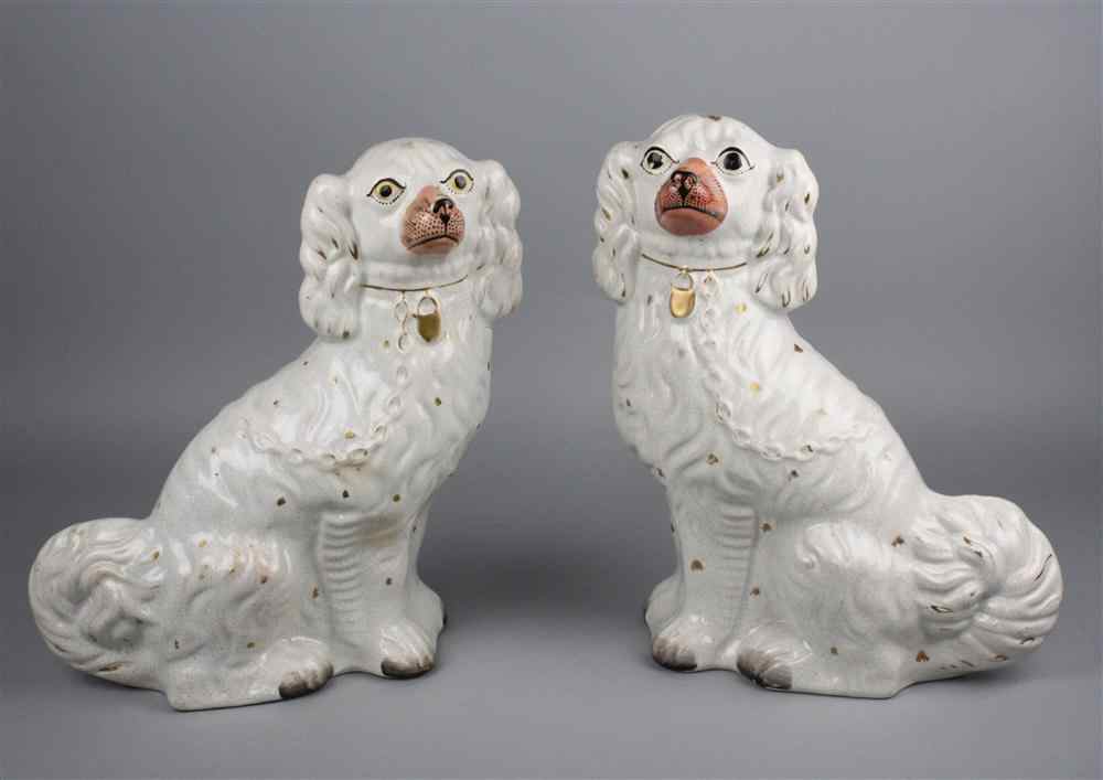 Appraisal: PAIR OF STAFFORDSHIRE FIGURES OF SPANIELS English late th century