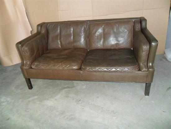 Appraisal: A DANISH CHOCOLATE BROWN LEATHER TWO SEAT SOFA