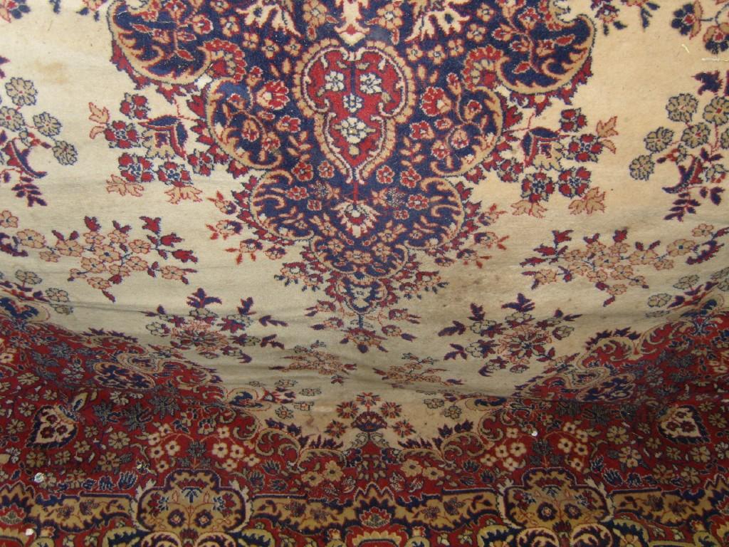 Appraisal: A large cream ground wool carpet in the Persian style