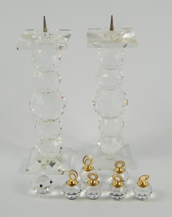 Appraisal: A pair of Swarovski pricket candlesticks a chick and six