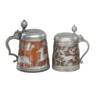 Appraisal: DAUBENKRUG OR PEWTER OVERLAID WOOD STEINS Two One depicting a