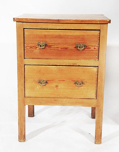 Appraisal: AN OLD PINE SIDE TABLE with two drawers and standing