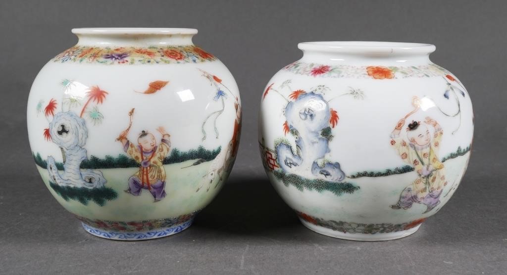 Appraisal: Pair of small Chinese ceramic vases with figures in a