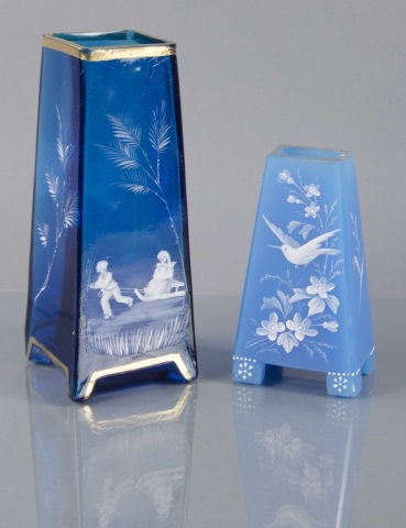 Appraisal: Two Mary Gregory Rectangular Blue VasesTaller transparent vase decorated with