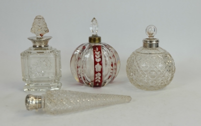 Appraisal: A collection of glass scent bottles with silver tops collars