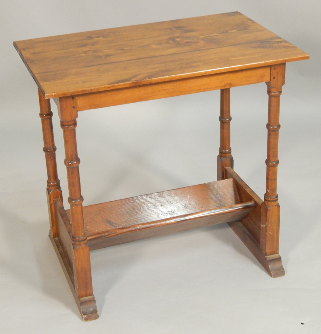 Appraisal: A pine occasional table the rectangular planked top on turned