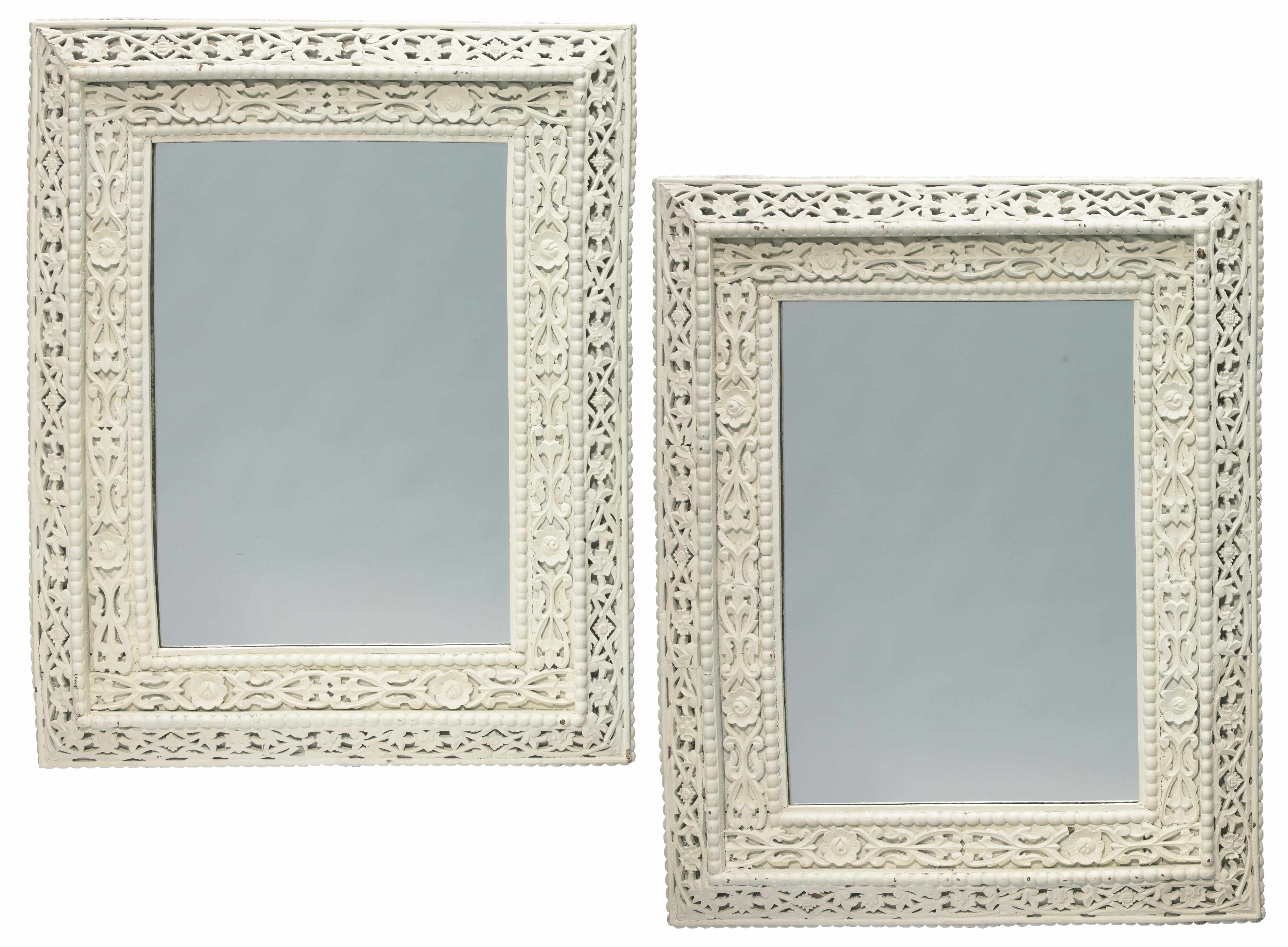 Appraisal: A pair of Victorian style white painted pierced-carved wall mirrors