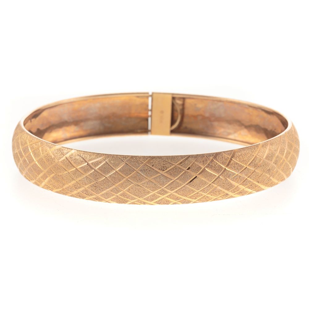 Appraisal: A Geometric Pattern Bangle Bracelet in K K yellow gold