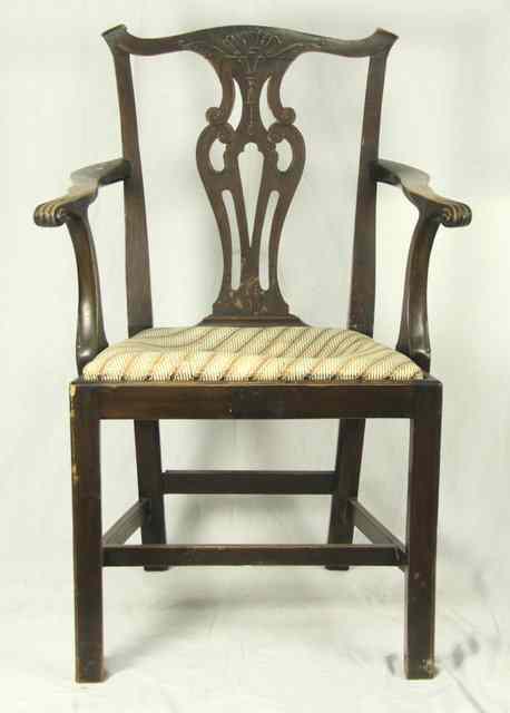 Appraisal: A late th Century armchair in beech with carved cresting