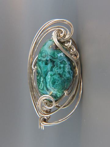 Appraisal: Malachite Sterling Silver Pendant beautifully grained stone in wire wrap