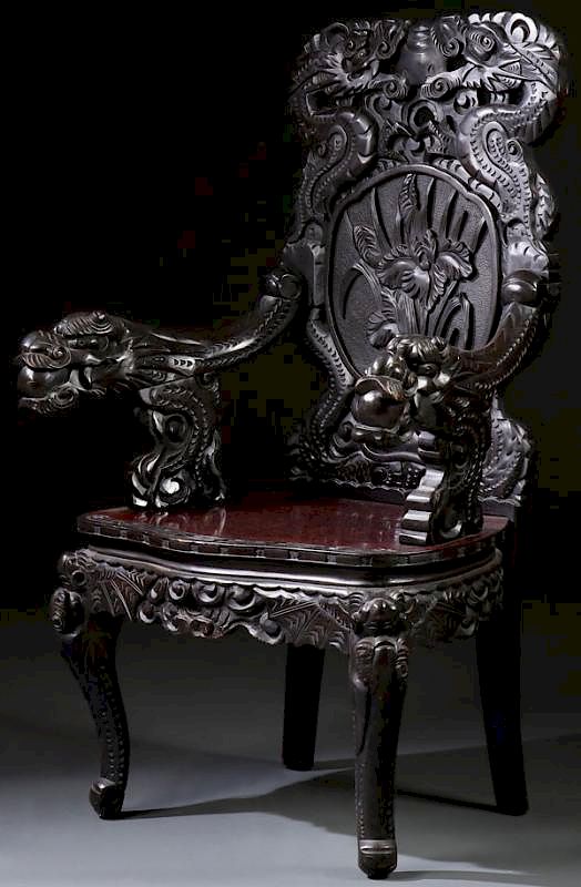 Appraisal: A JAPANESE CARVED EBONIZED WOOD DRAGON ARMCHAIR A JAPANESE CARVED