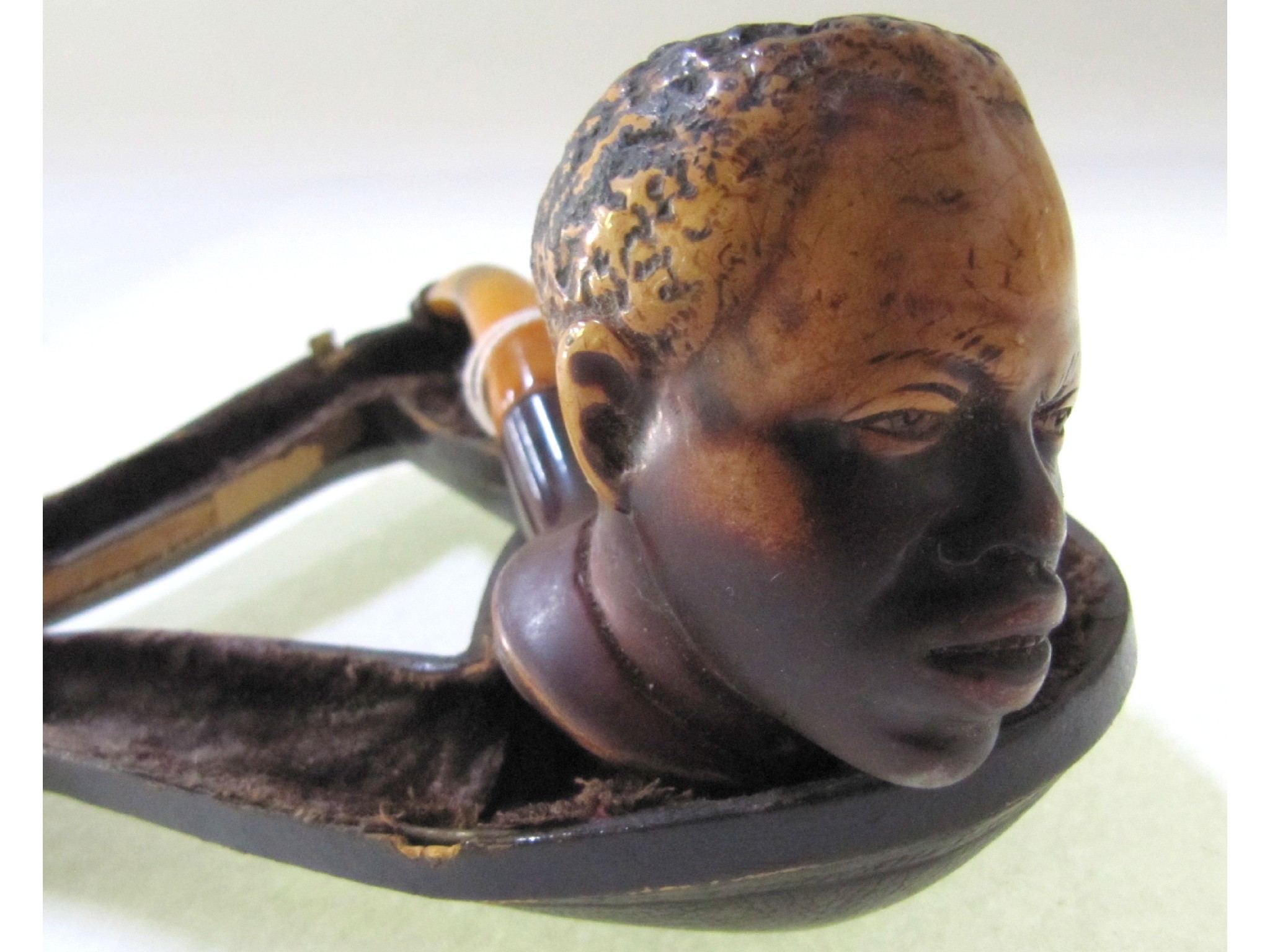 Appraisal: A pipe in case the bowl modelled as an African