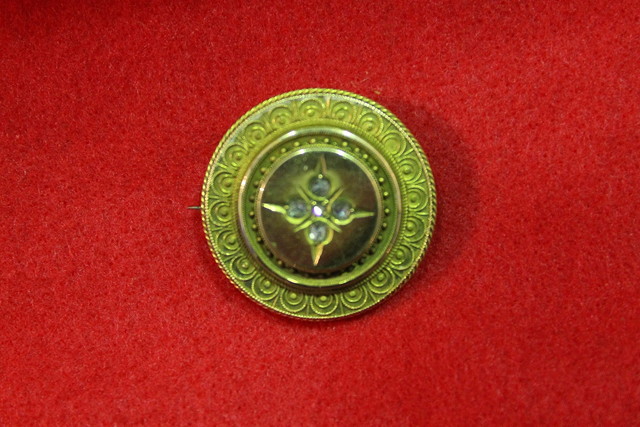 Appraisal: A VICTORIAN BAR BROOCH of circular form with relief decoration