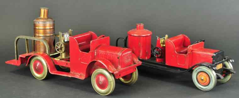 Appraisal: TWO FIRE TRUCKS Light pressed steel includes an Oh-Boy Kiddie