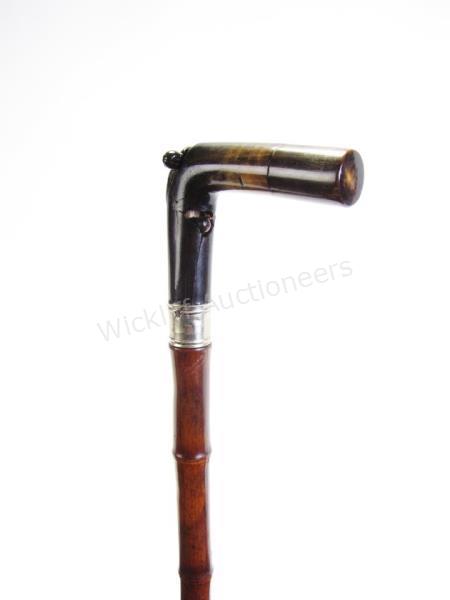 Appraisal: Gentleman's Gun Cane bamboo and metal shaft horn handle holds