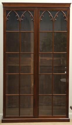 Appraisal: AMERICAN GOTHIC REVIVAL MAHOGANY BOOKCASE The rectangular molded top over