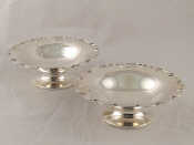 Appraisal: A pair of silver dishes with shaped lobed rims on