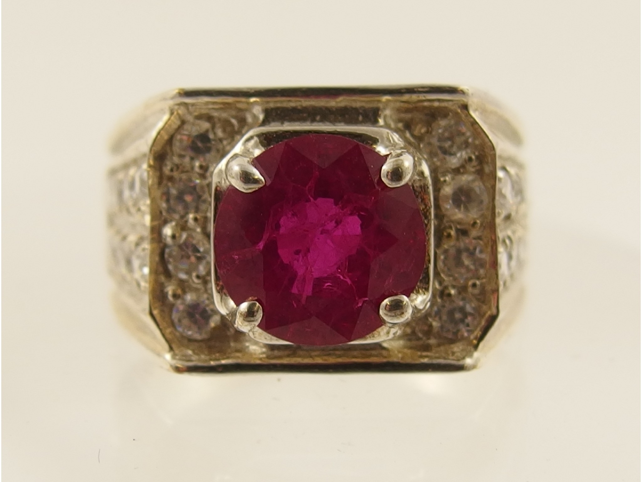 Appraisal: A silver ruby and clear topaz ring