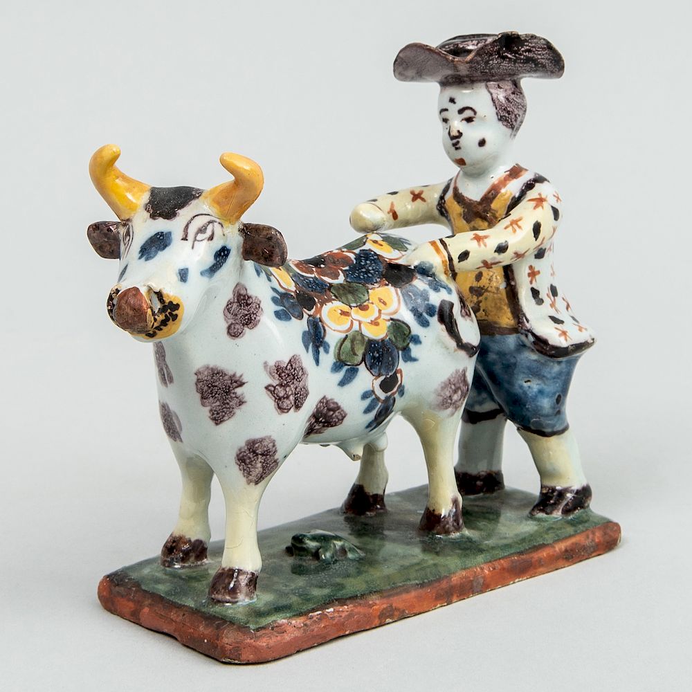 Appraisal: Dutch Polychrome Delft Small Group of a Man and Cow