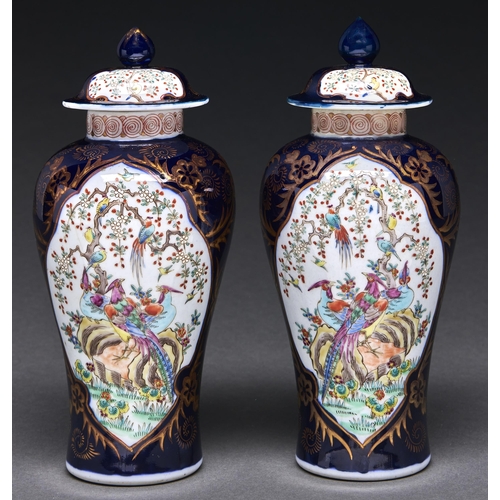 Appraisal: A pair of Samson blue ground famille rose style vases