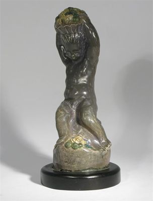 Appraisal: A pottery figure of a putto possibly by Phoebe Stabler