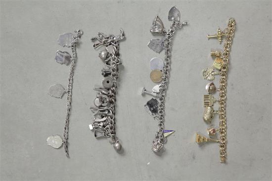 Appraisal: FOUR CHARM BRACELETS One cowboy wild west themed bracelet with