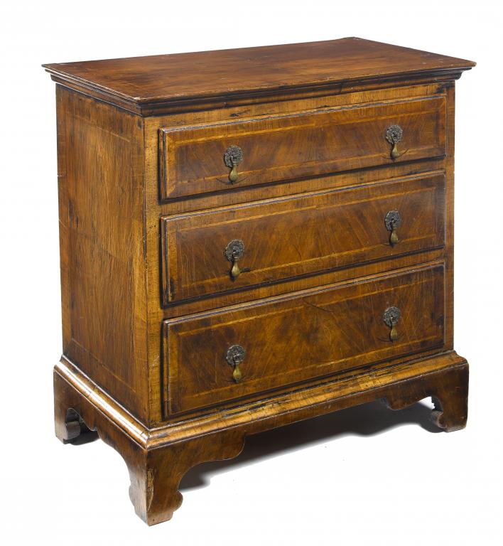 Appraisal: A WALNUT AND FEATHERBANDED MINIATURE CHEST OF DRAWERS the moulded