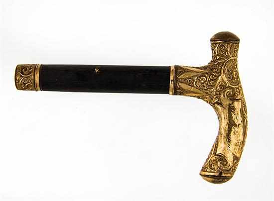 Appraisal: Chased gold cane handle late th century K yellow gold