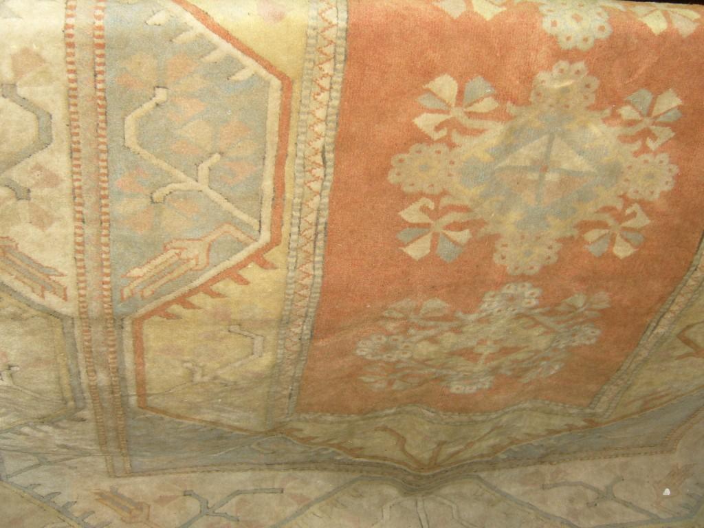 Appraisal: An eastern wool carpet with stylised floral and geometric decoration