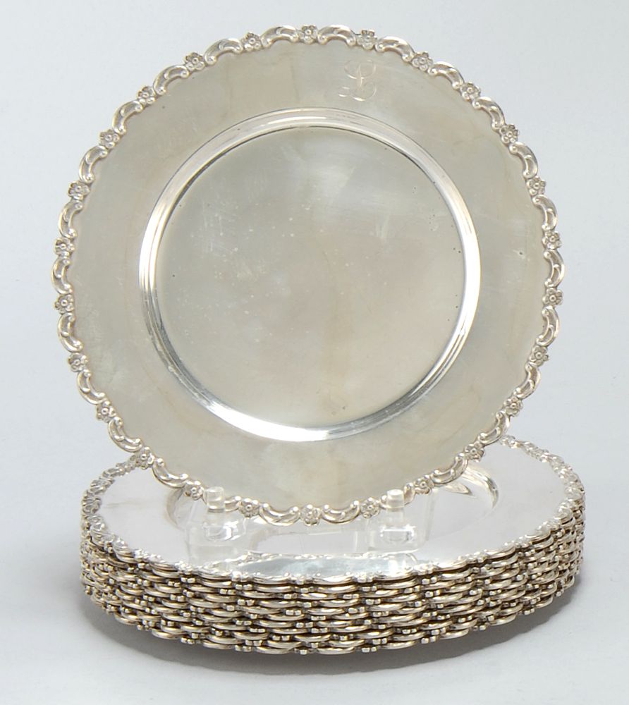 Appraisal: SET OF TWELVE STERLING SILVER BREAD BUTTER PLATES With foliate